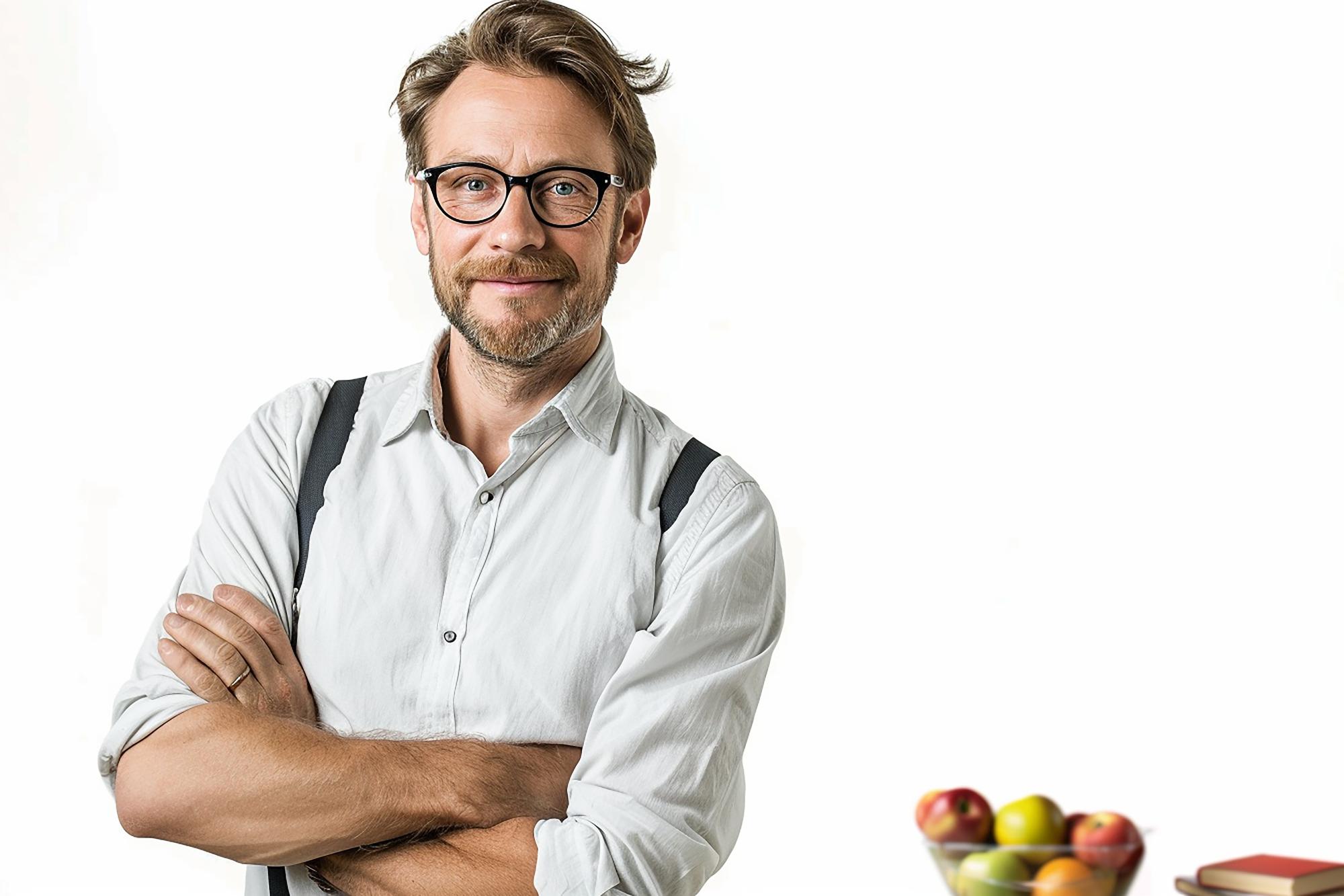 Local chef smiling in small studio kitchen